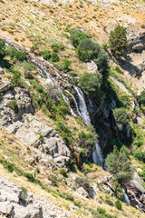 The scenic views of Gömbe Uçarsu Waterfall which  fly like a white cloud down the rocks at an altitude of about 50 meters, with a cave underneath, Gömbe, Kaş, Antalya