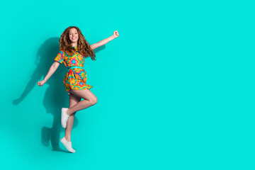 Full size photo of pretty teen girl flying superhero jumping wear trendy colorful outfit isolated...