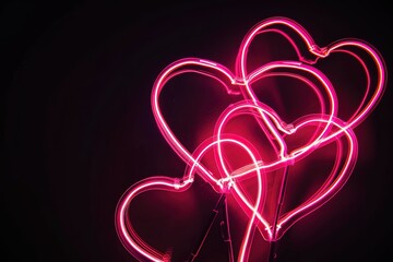 Composition of pink neon hearts on a black background