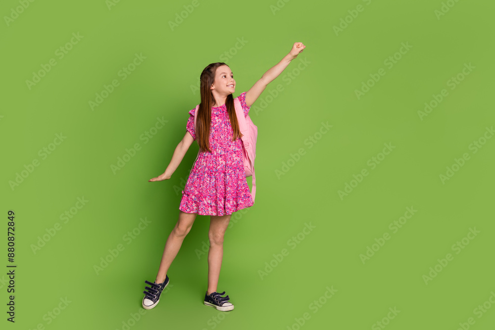 Sticker Full size photo of cute schoolgirl rucksack empty space wear pink dress isolated on green color background