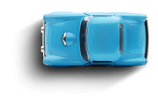 A top view of a blue toy car photographed on a transparent background.