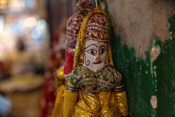 Interior decoration, Handmade colorful hanging puppets for decoration on display at shop. Selective...