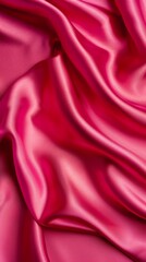 Obraz premium Close up of soft pink satin fabric with smooth, flowing folds.
