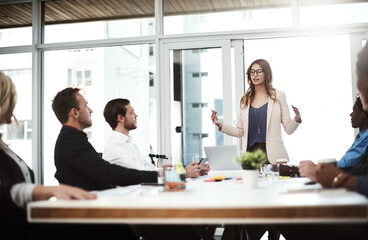 Presentation, leader and team of business people in training, brainstorming or planning startup ideas. Creative group, diversity and editor in discussion for project strategy, news and blog on laptop