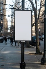 metal pole with empty white poster frame in urban area