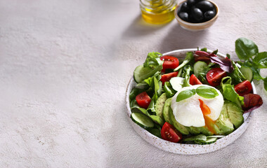 fresh salad with poached egg and avocado