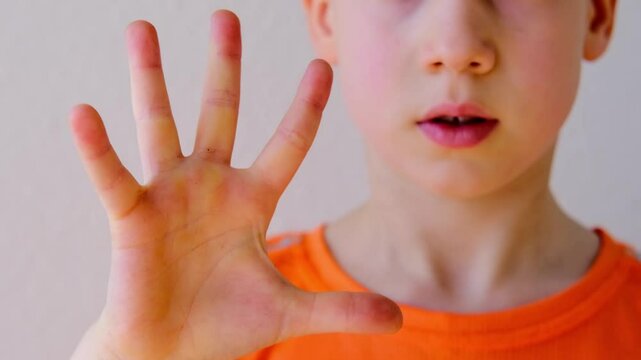 Close-up of child's fingers counting from 1 to 5, 9-year-old boy making gesture, Counting Skills concept, Pedagogical Practices for Children, Fine Motor Skills Development