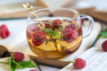 Fruit red tea with berries in glass cup on white background