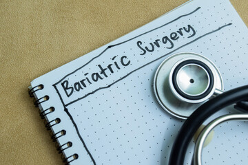 Concept of Bariatric Surgery write on book isolated on Wooden Table.