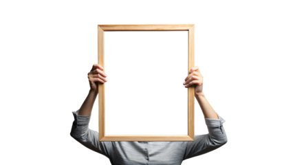 A holding a blank frame and board with a hand 