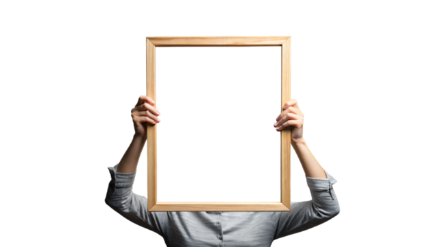 A holding a blank frame and board with a hand 