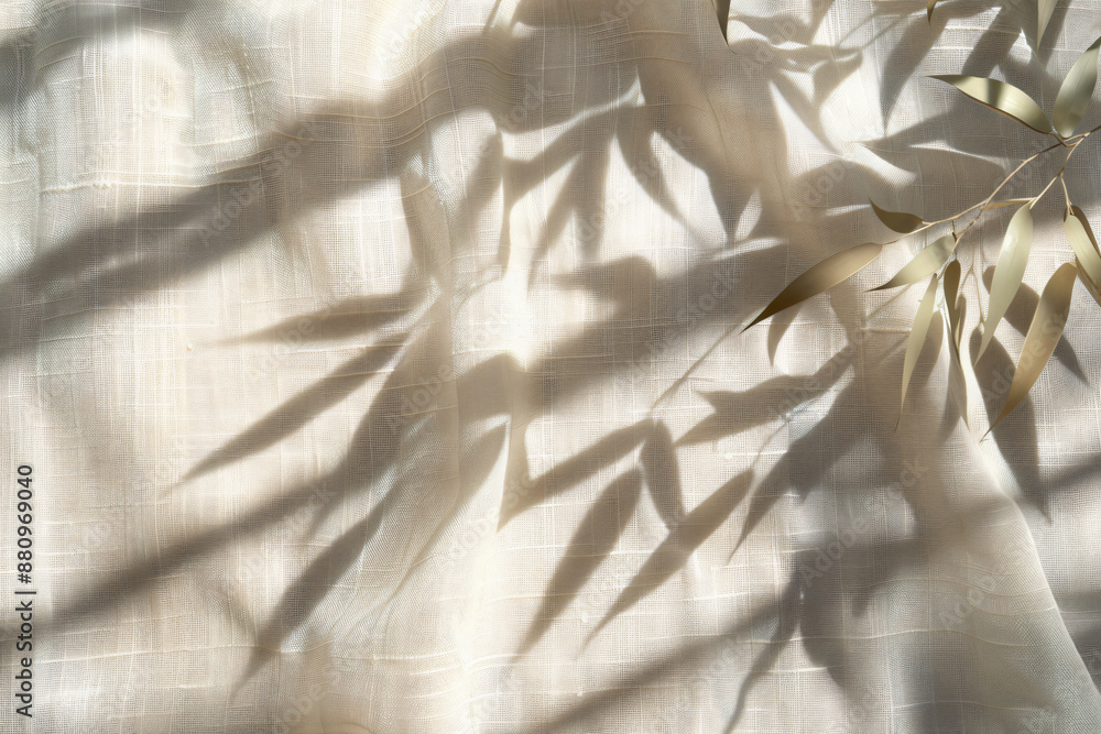 Aufkleber photo of a shadow cast on beige linen fabric in the style of bamboo leaves, creating an organic text
