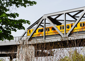 Yellow Train on Steel Bridge