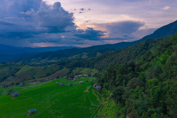 Fototapeta premium Golden time of sunset at Rice terrace in Baan-Pa-Bong-Piang, Chiangmai,Thailand