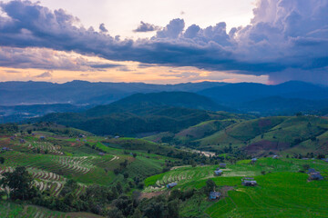 Fototapeta premium Golden time of sunset at Rice terrace in Baan-Pa-Bong-Piang, Chiangmai,Thailand