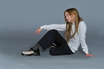 Young model with a contented smile, comfortable in her winter attire, captures the essence of joyful winter days.