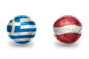 Obraz premium football balls with national flags of latvia and greece , soccer teams. on the white background.