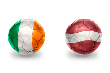 football balls with national flags of latvia and ireland ,soccer teams. on the white background.
