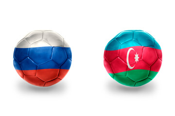 Fototapeta premium football balls with national flags of azerbaijan and russia ,soccer teams. on the white background.
