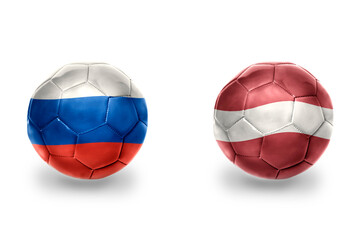 football balls with national flags of latvia and russia ,soccer teams. on the white background.