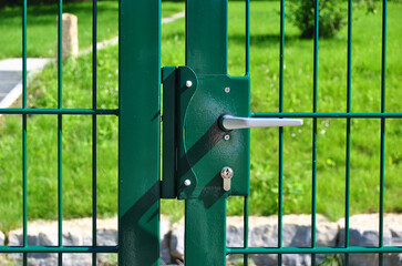 Lock and Handle on Modern Steel Garden Gate in Close Up 