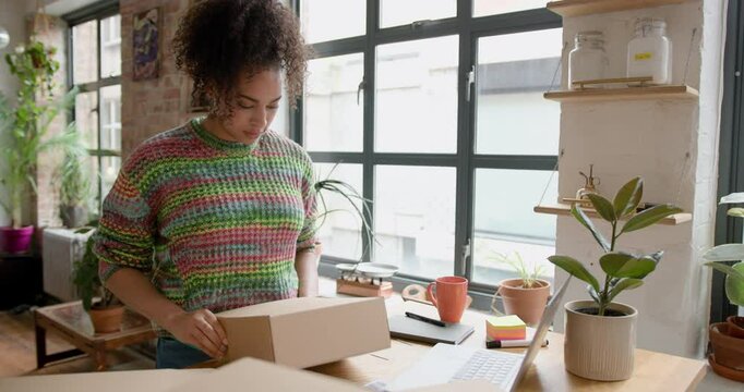 Young Adult Female Packing Orders, Vintage Fashion Business Owner