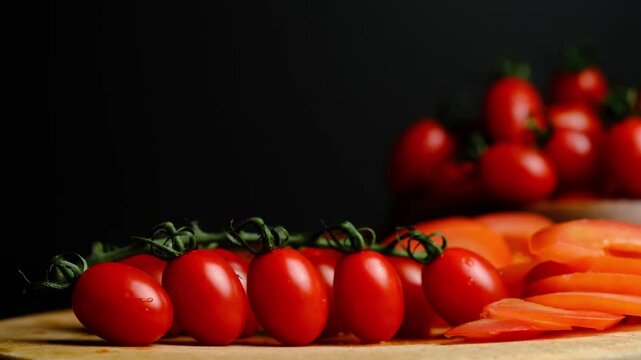 juicy cherry tomatoes on a black background