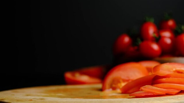 juicy cherry tomatoes on a black background