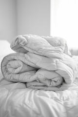 A stack of pillows sitting on top of a bed