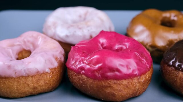 a large number of donuts on a plate