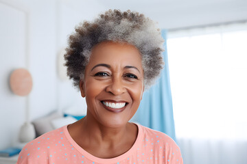 Close up photo of a happy senior African American woman in pastel shirt taking a selfie