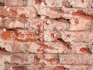 rough texture of damaged rough brick wall