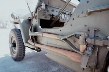 military vintage classic retro jeep car khaki side view of the wheel and part of the interior