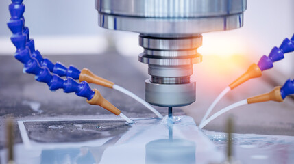Working closeup CNC turning cutting metal Industry machine iron tools with splash cutting fluid...