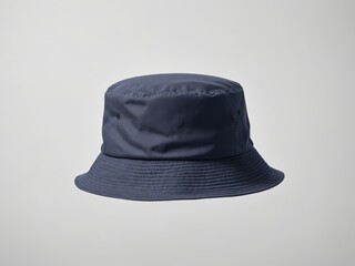 navy bucket hat mockup sits alone on a crisp white background, ready for summer adventures.  This cheerful hat is a perfect addition to any beach day or poolside relaxation.