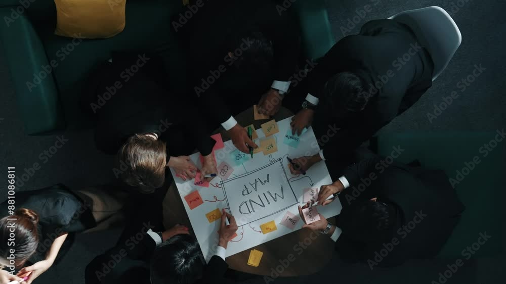 Aufkleber top down aerial view of group of smart diverse business people brainstorm marketing idea while writi