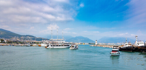 Tourist ships at sea on coast of Alanya. Landscape view of Mediterranean coast, Alanya, Turkey