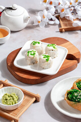 sushi is a Japanese dish of prepared vinegared rice, usually with some sugar and salt, accompanied by a variety of ingredients such as seafood, often raw and vegetables.
