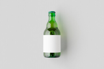 Green steinie beer bottle mockup with blank label.