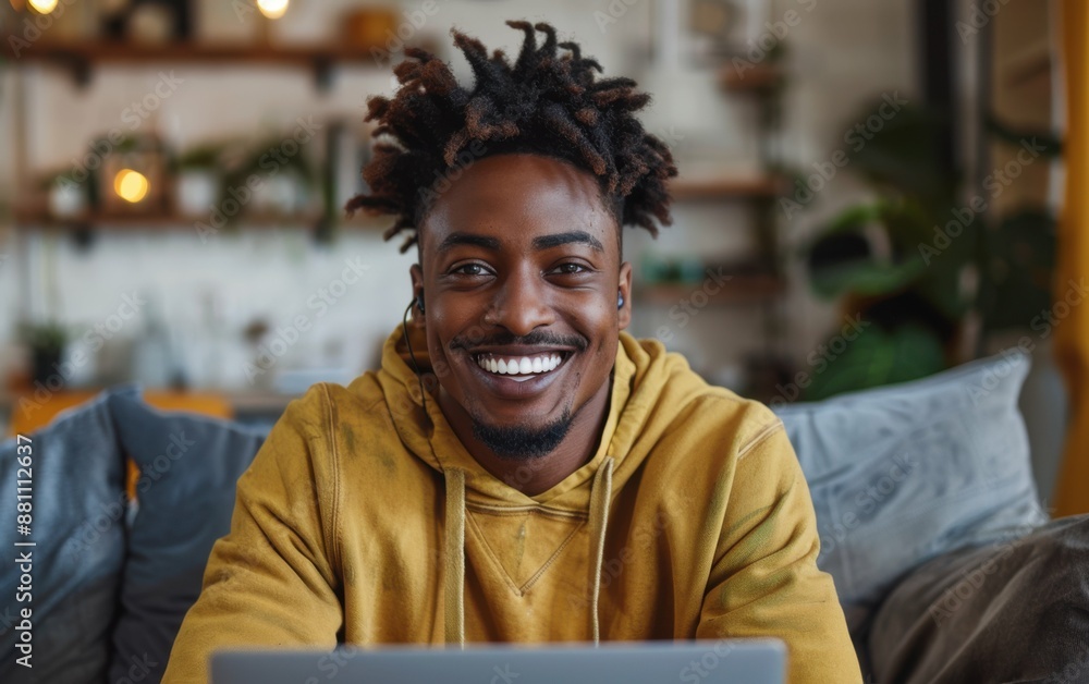 Aufkleber a man with dreadlocks is smiling and sitting on a couch with a laptop in front of him