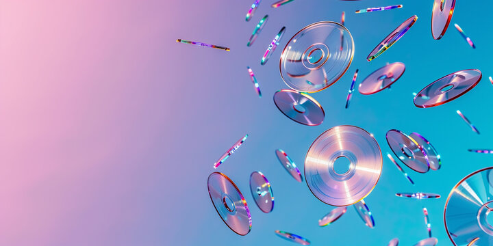 CDs float in pink and blue light