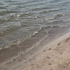 Waves at the beach a sunny day. Background concept.