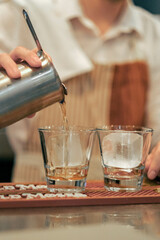 bartender pouring cocktail