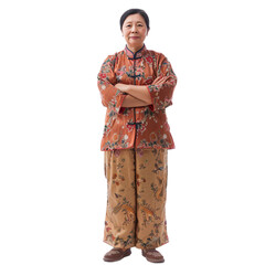 Fototapeta premium Full length portrait of an elderly asian woman standing with crossed arms, isolated on a transparent background