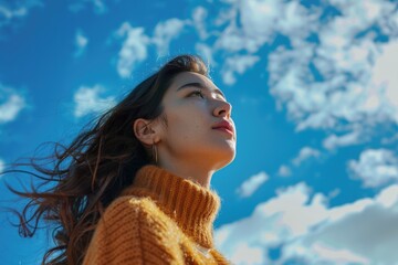 Woman gazing up at the sky