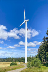 Windmill, wind turbine in farm landscape