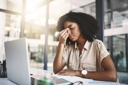 Frustrated woman, stress and laptop with headache in depression, pain or debt at office. Tired female person or employee with migraine, mistake or pressure in fatigue, burnout or loss at workplace
