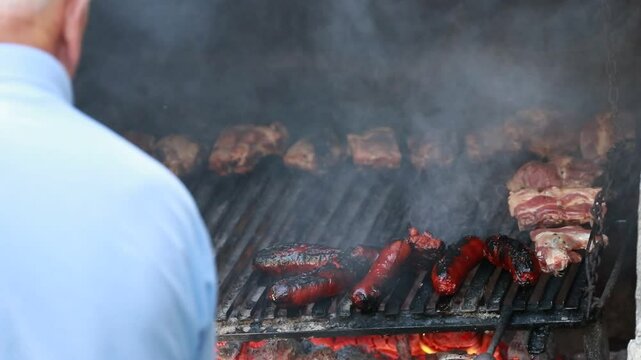 man grilling meat, churrasco