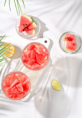 Watermelon frozen margarita cocktail with fresh slices of watermelon, lime and mint, summer party and vacation concept, bar advertising, cafe, selective focus.