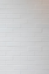 A minimalist white brick wall showcasing clean lines and a smooth texture, perfect for modern interior design and architectural projects. This seamless pattern adds a touch of simplicity and elegance